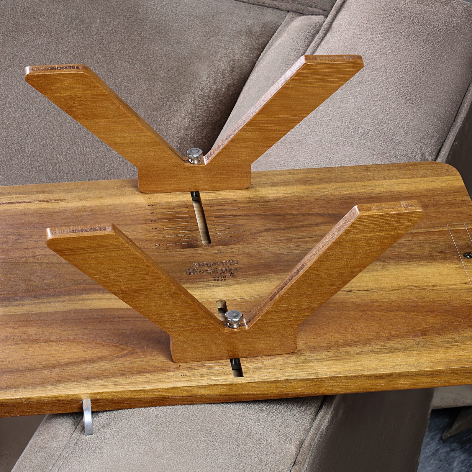Underside of the acacia tray showing the adjustable non-spring clamp mechanism